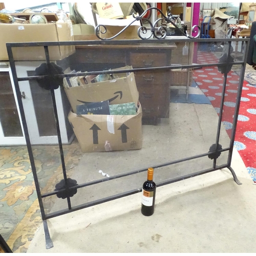 421 - A large wrought iron fire screen