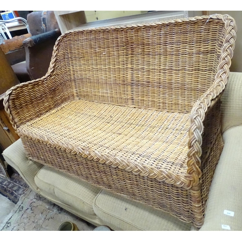 428 - A wicker settee