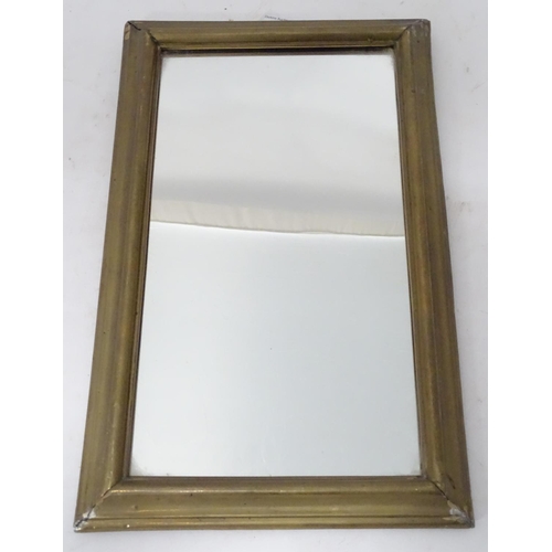 447 - A brass framed rectangular mirror