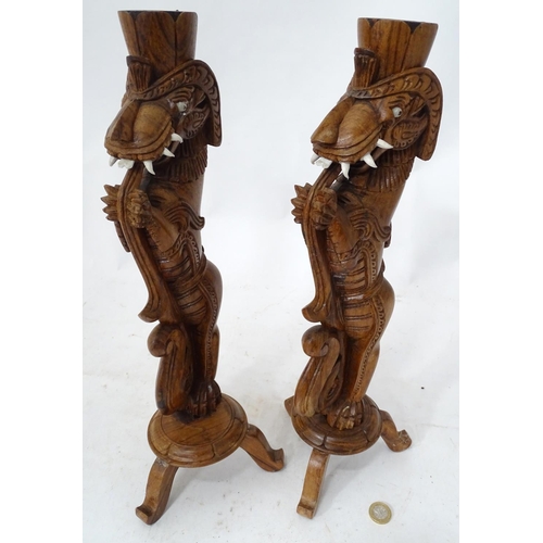 469 - A pair of carved wooden stylised dragons