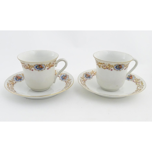 47 - A Czecho Slovakie tea set with banded decoration to include still lifes in vignettes. Includes cups ... 