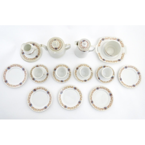 47 - A Czecho Slovakie tea set with banded decoration to include still lifes in vignettes. Includes cups ... 