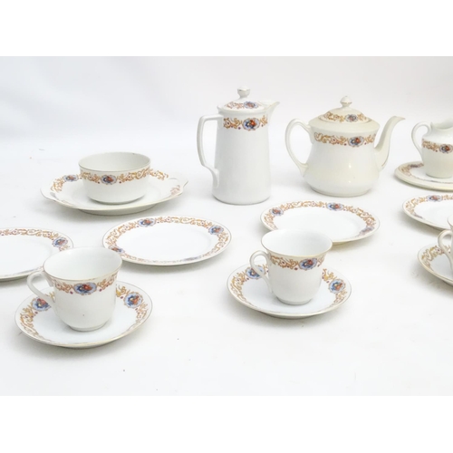 47 - A Czecho Slovakie tea set with banded decoration to include still lifes in vignettes. Includes cups ... 