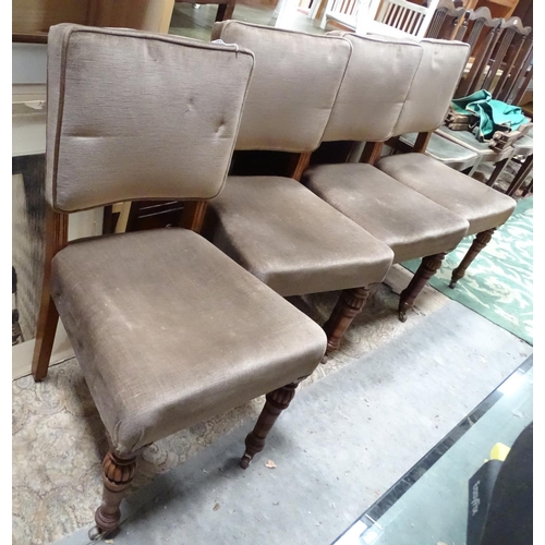 470 - A set of four late 19thC oak dining chairs with upholstered backrest, seat and raised on gadrooned t... 