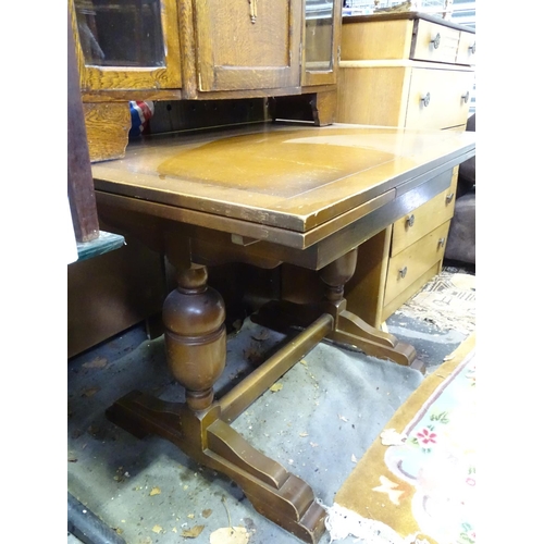 473 - 1940's bureau with glazed sections either side, together with a draw-leaf table (2)