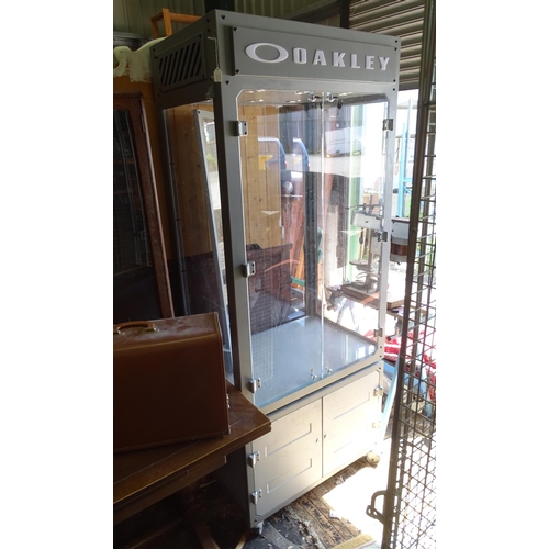 475 - An Oakley sunglasses display cabinet