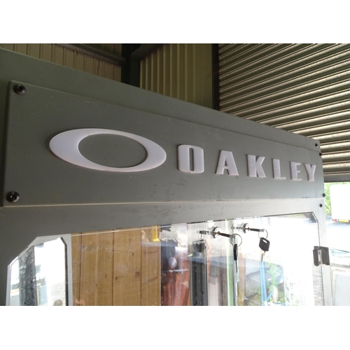 475 - An Oakley sunglasses display cabinet