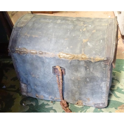 494 - A domed top canvas travelling trunk