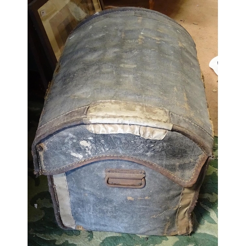 494 - A domed top canvas travelling trunk