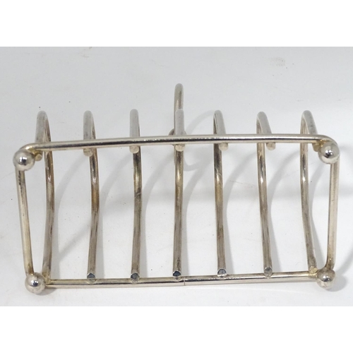 499 - A silver plated 6 section toast rack with central loop handle