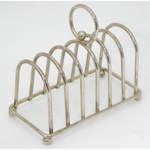 499 - A silver plated 6 section toast rack with central loop handle