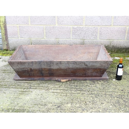 530 - Salvage , Garden and Architectural: a 19thc wooden planter , formerly an elm Dough bin, measuring 47... 