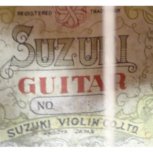 55 - A classical guitar made by Suzuki violin company, Nagoya, Japan.