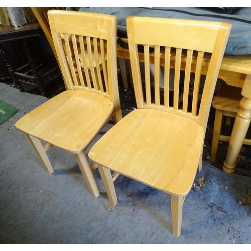 571 - A satin finished pine kitchen table and 4 matching chairs