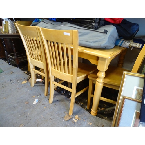 571 - A satin finished pine kitchen table and 4 matching chairs