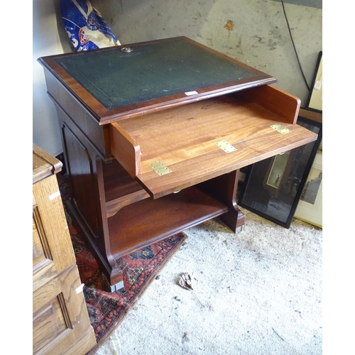 585 - A leather topped mahogany desk