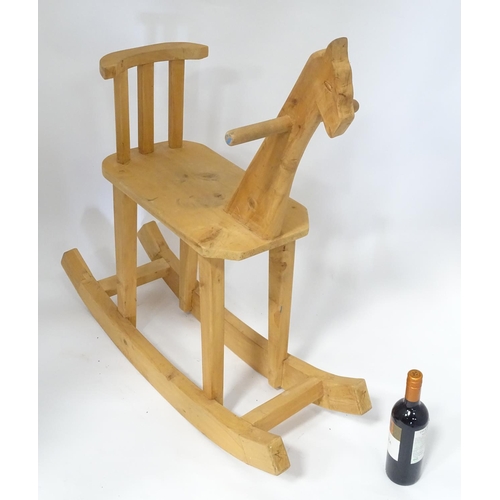 60 - A carved wooden rocking horse