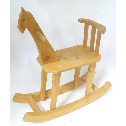 60 - A carved wooden rocking horse