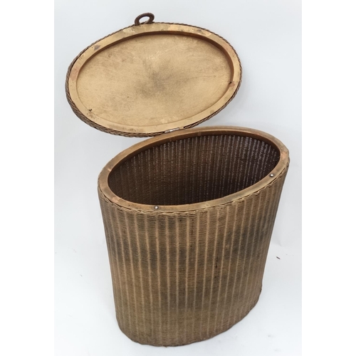 65 - A Lloyd loom style laundry basket