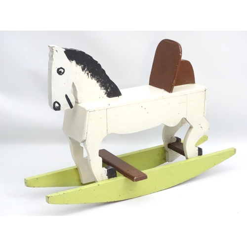 66 - Rocking horse : a scratch built and painted wooden rocking horse on bows with brown painted back and... 