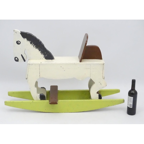 66 - Rocking horse : a scratch built and painted wooden rocking horse on bows with brown painted back and... 