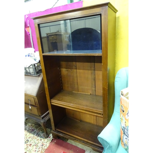 67 - A large stained pine 4 tier bookcase, with glazed and blue baize lined top section