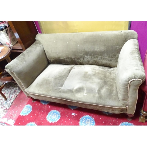 73 - A 2 seater Edwardian Chesterfield style turned leg sofa