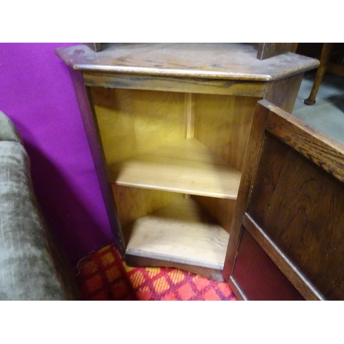 74 - An oak corner cupboard with rose detail