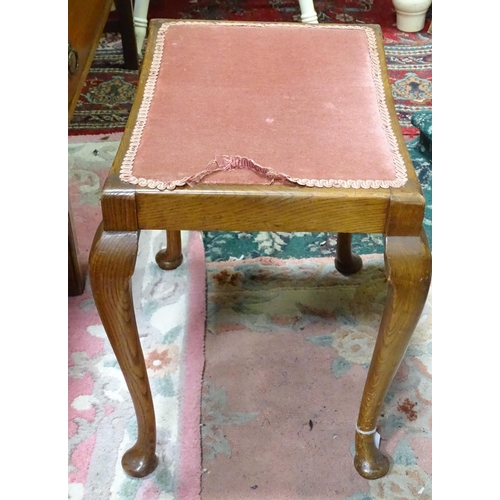 76 - An upholstered oak piano stool