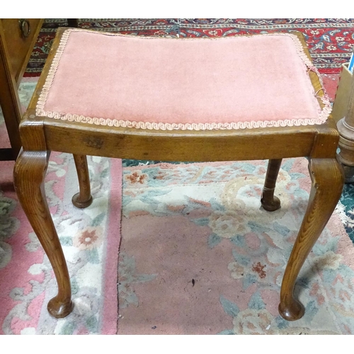 76 - An upholstered oak piano stool