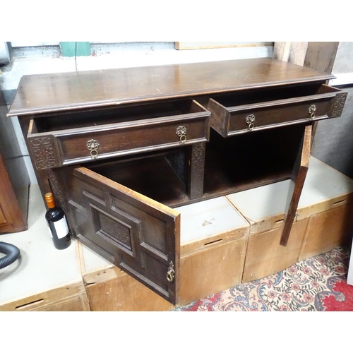 83 - An oak lowboy/small cupboard