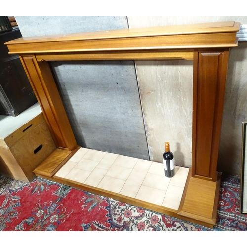 86 - A mahogany fire surround and base