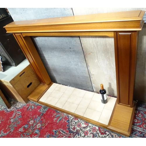 86 - A mahogany fire surround and base