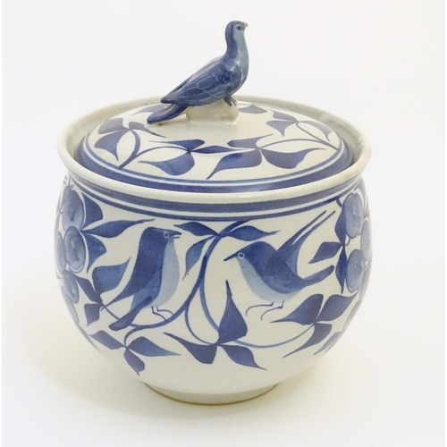 101 - A Laurence McGowan British studio pottery lidded pot, with hand painted decoration of birds amongst ... 