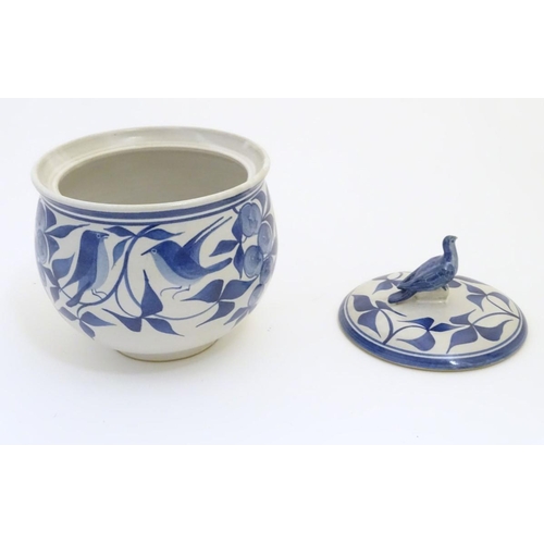 101 - A Laurence McGowan British studio pottery lidded pot, with hand painted decoration of birds amongst ... 