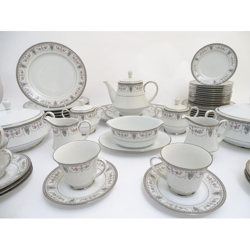 103 - A quantity of Noritake 'Clarice' dinner/tea wares, made in Japan, with pink rose and silver lustre g... 