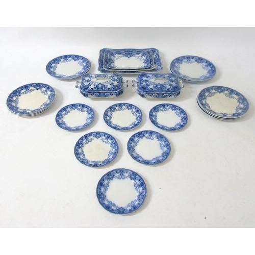 105 - An early 20thC Ford & Sons Burslem Flow Blue and white dinner service in Devon pattern including din... 