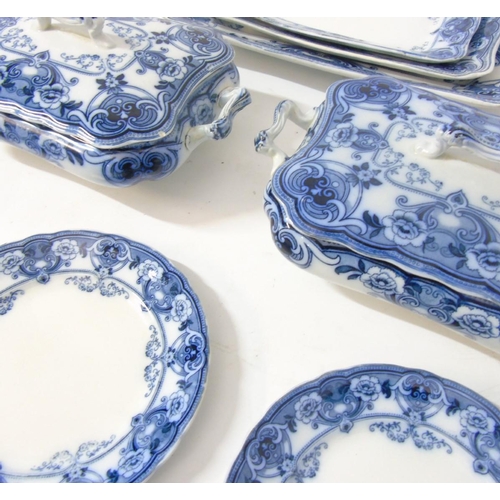 105 - An early 20thC Ford & Sons Burslem Flow Blue and white dinner service in Devon pattern including din... 