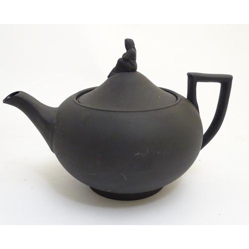 106 - A quantity of assorted teapots, to include a Wedgwood black basalt teapot with a female figural fini... 