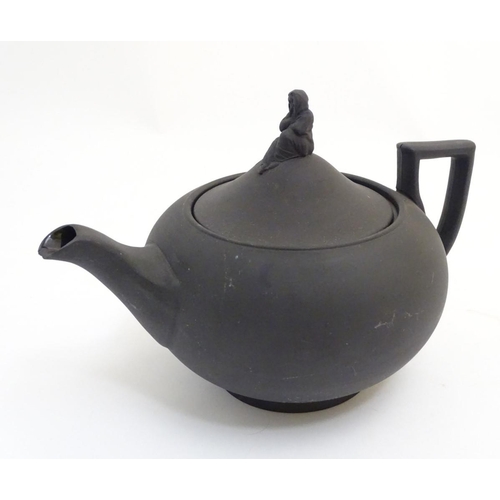 106 - A quantity of assorted teapots, to include a Wedgwood black basalt teapot with a female figural fini... 