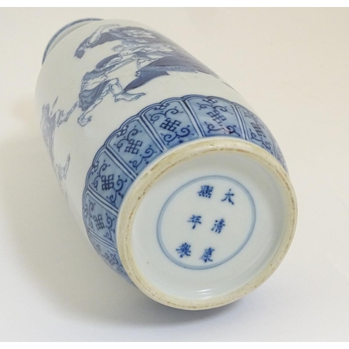 11 - A Chinese blue and white Rouleau vase, decorated in an underglaze blue depicting the Chinese mytholo... 