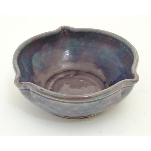 110 - A Baron Barnstable studio pottery dish / bowl with a mottled purple and blue glaze and three spout d... 