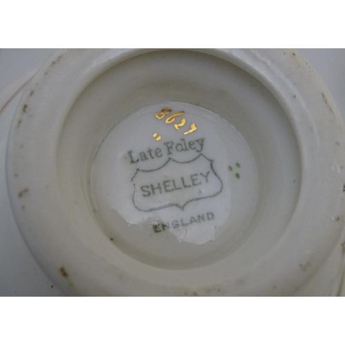 111 - An early 20thC Shelley ' Late Foley '' tea set , to include 11 plates, 11 saucers, 9 cups , milk jug... 