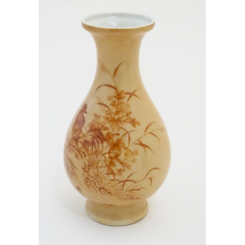 12 - A Chinese baluster vase with a buff coloured ground decorated with a hen, chicken and chicks in a ro... 