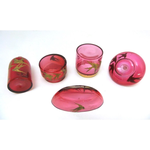 129 - Glass : a 5 piece c. 1910 Cranberry glass dressing table set with gilded swallow decoration , compri... 