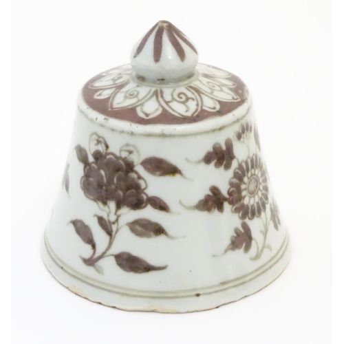 13 - A Chinese brown and white bell-shaped cover with floral decoration. 4'' high.