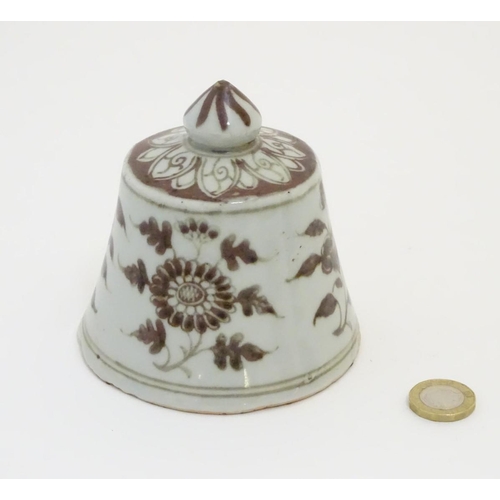 13 - A Chinese brown and white bell-shaped cover with floral decoration. 4'' high.