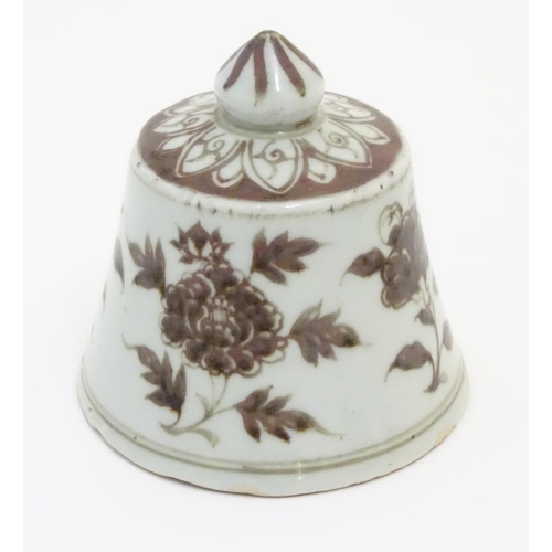 13 - A Chinese brown and white bell-shaped cover with floral decoration. 4'' high.