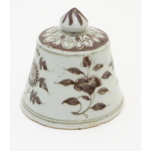 13 - A Chinese brown and white bell-shaped cover with floral decoration. 4'' high.