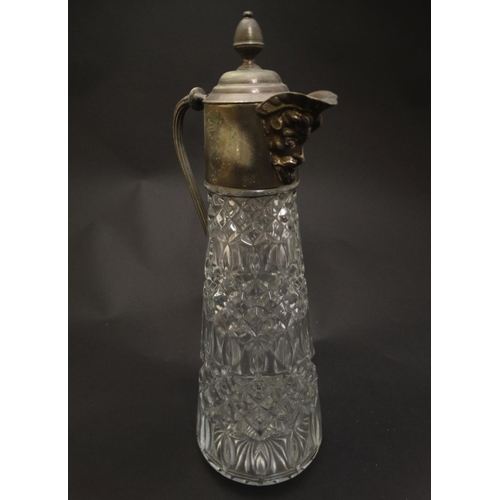 132 - A glass claret jug  with silver plate handle and mounts 11 1/2'' high overall